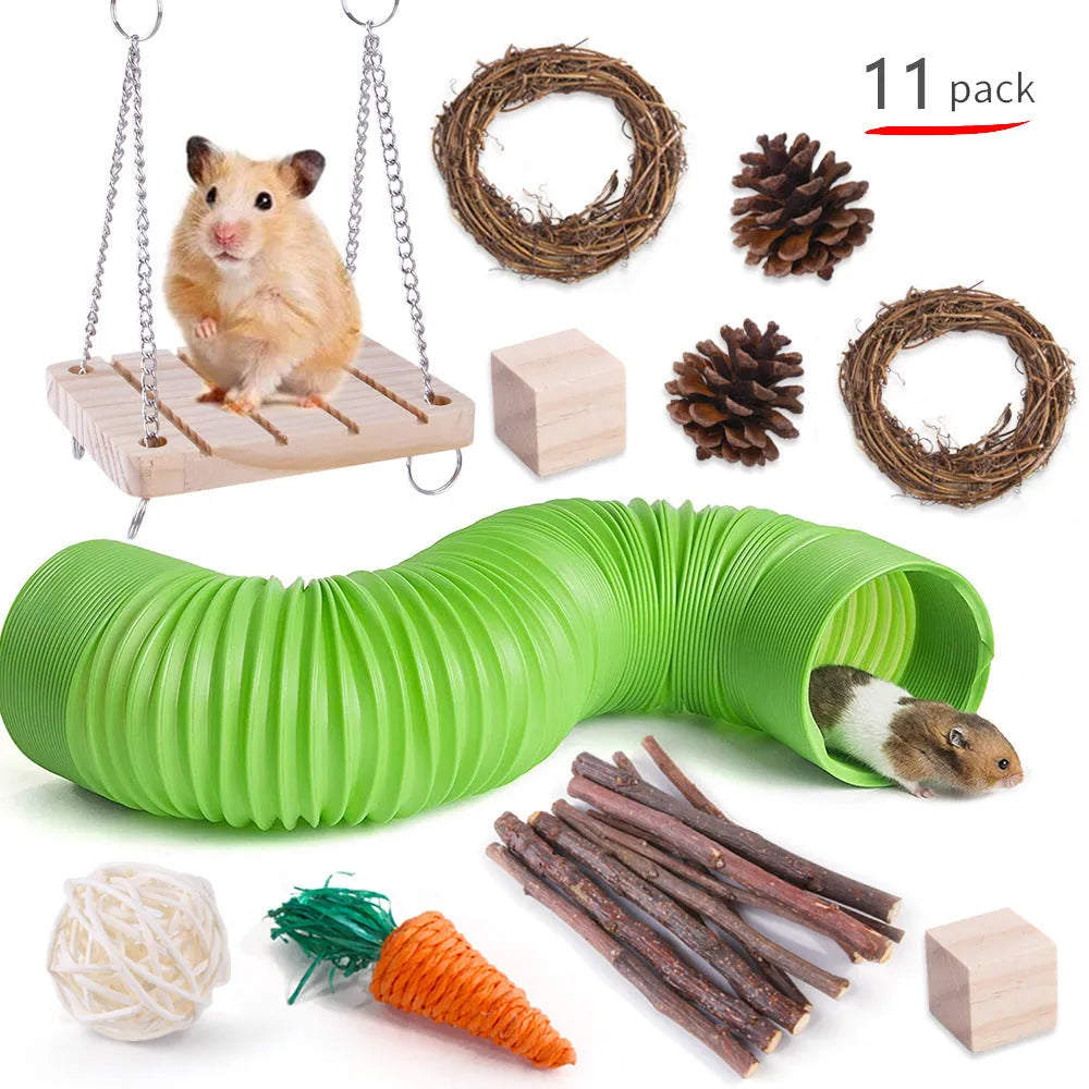 Assortment of wooden and natural fibre chewing toys for pet rabbits, guinea pigs, and parrots on a straw mat