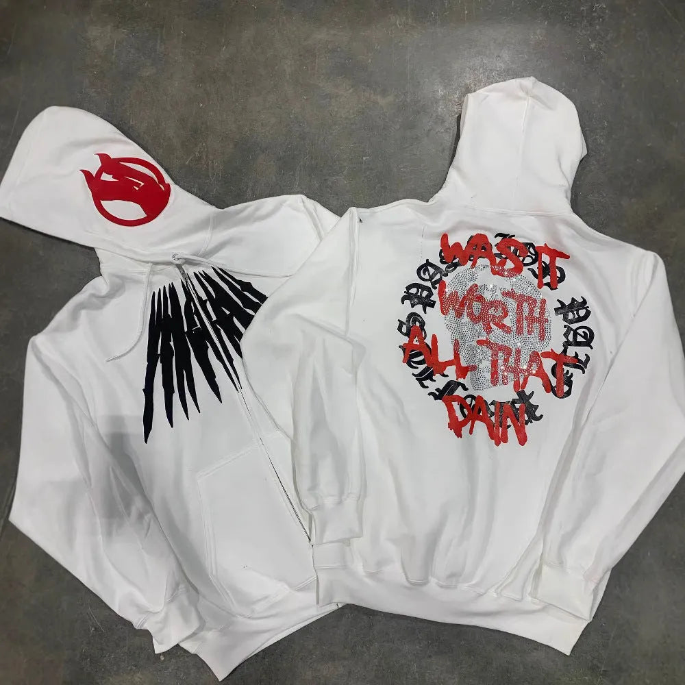 Black hooded sweatshirt cardigan with a white printed skull and rhinestone design on the front.