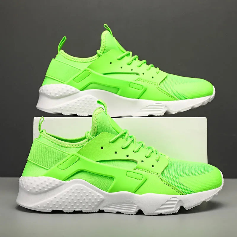 Men's low top casual shoes in green with mesh upper, flat heel, and lace-up front closure