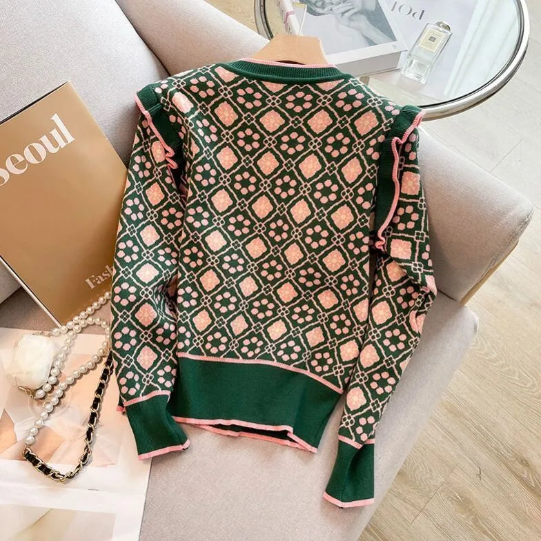 Green printed women's loose fit sweater on a hanger, free size.