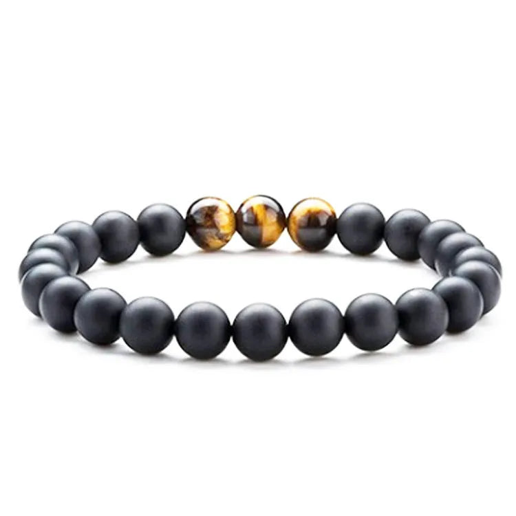 Geometric couple bracelet made of matte black agate beads with a tiger eye stone.