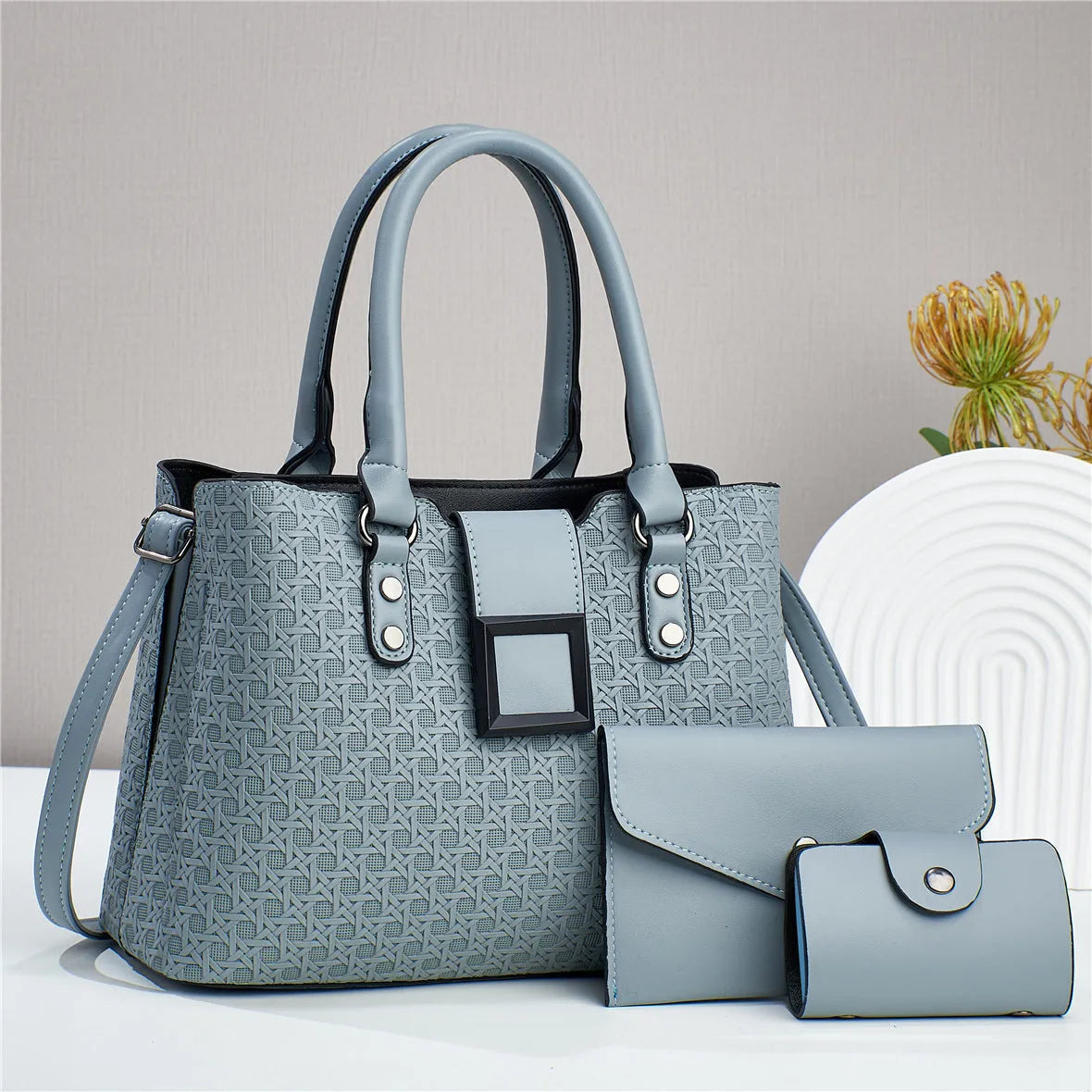 Three-piece women's crossbody bag in textured PU with square shape and open pocket