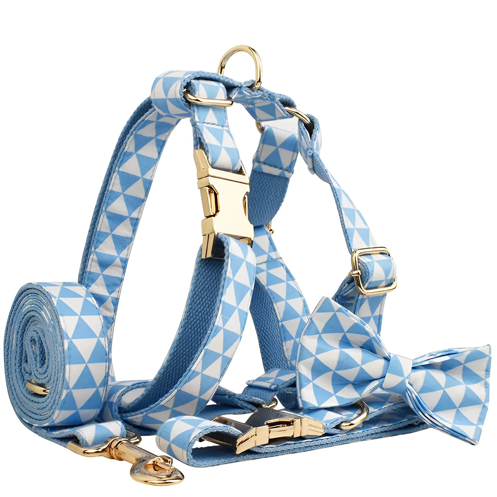 Blue triangular pattern dog harness set with matching leash, collar, and fabric bow accessory