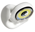 White Atomic Angel induction-activated LED night light on a surface.