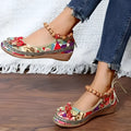 Women's black ethnic style platform sandals with elastic band closure, fabric upper, and round toe.