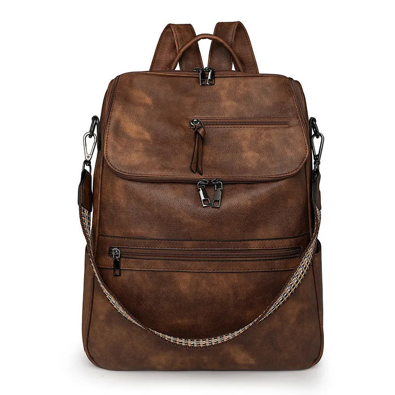 Retro college backpack in PU material with a curved shoulder strap shown in multiple colour options.