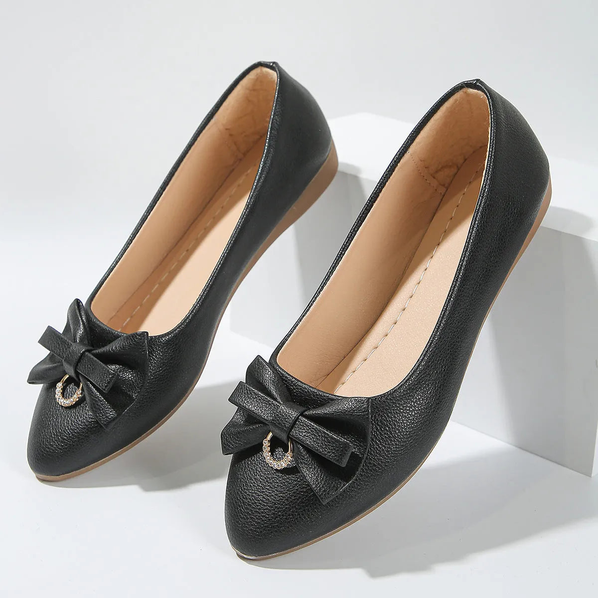 Women's beige flat casual shoes with a bowknot and shallow mouth design on a rubber sole