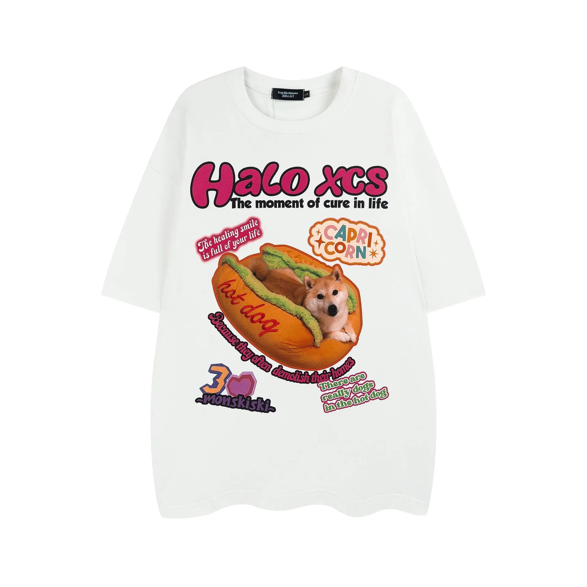 White short-sleeved cotton t-shirt with a cartoon hamburger dog graphic print, shown on a model.