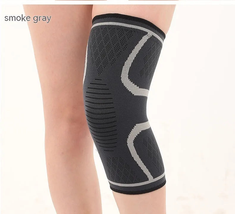 Stretch polyester sports kneepad with corrugated texture in black, shown on a knee.