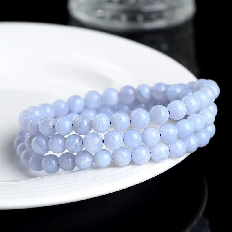 Blue agate bracelet with natural striped beads and Ruyi design elements