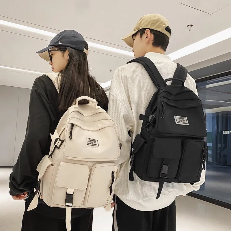 Black and white nylon student backpack with laptop compartment and three-dimensional pockets
