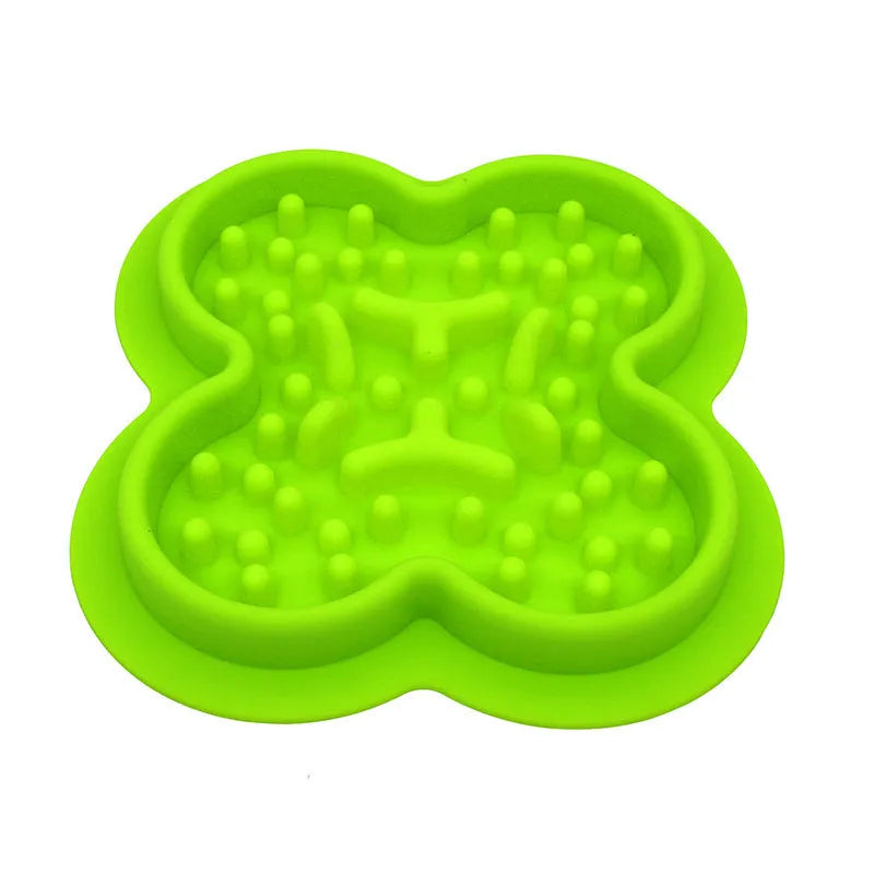 Silicone pet slow feeder licking mat in green colour with textured surface and non-slip base.
