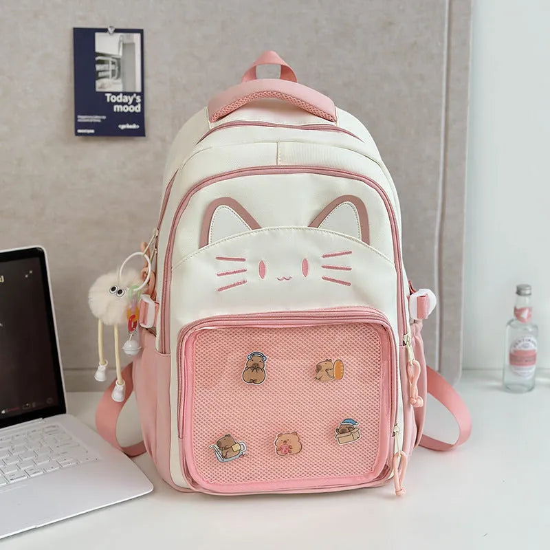 Korean cartoon large capacity nylon backpack in pink colour with badge pendant.