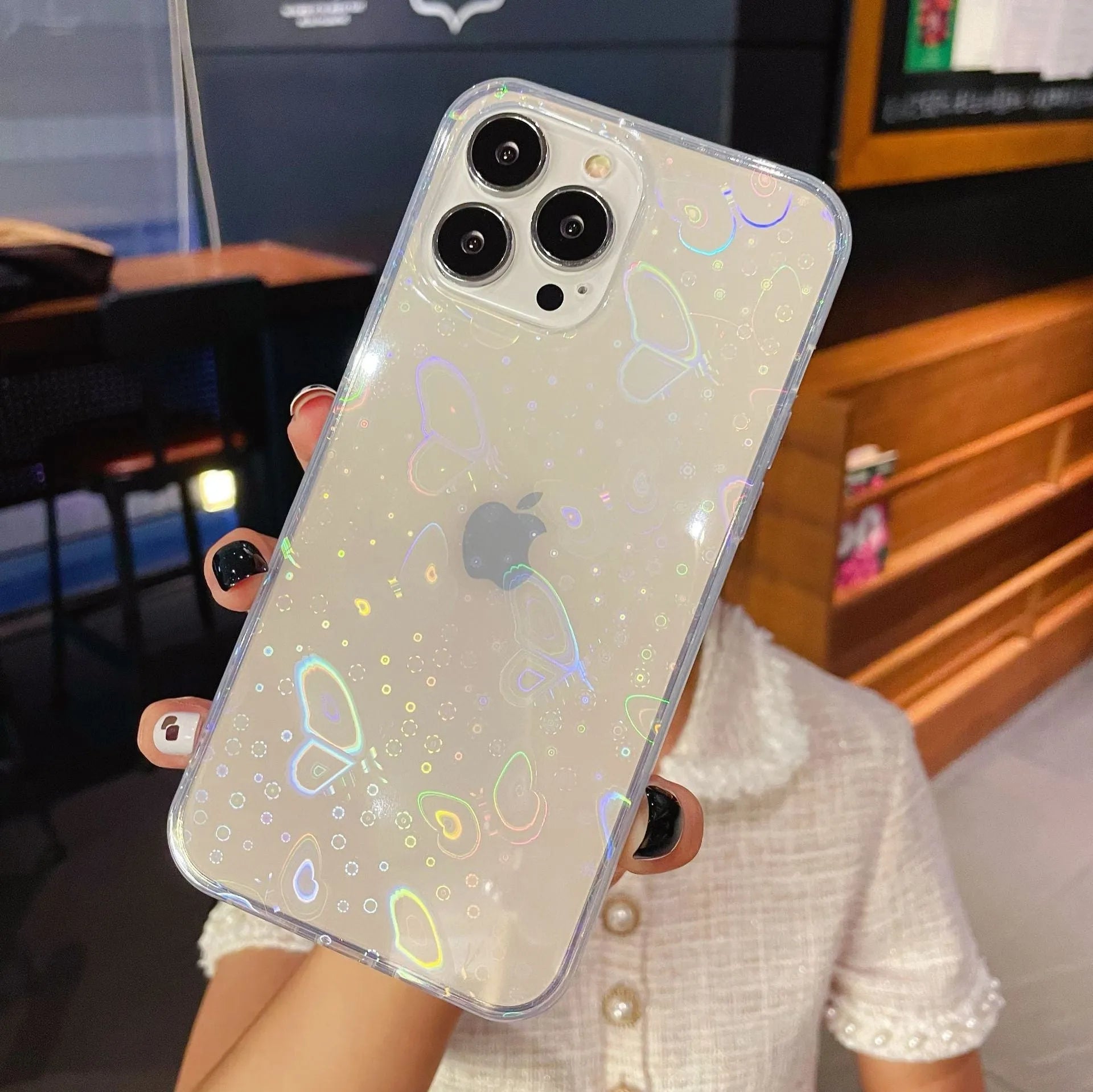 Transparent silicone iPhone case with laser colourful love design shown on iPhone