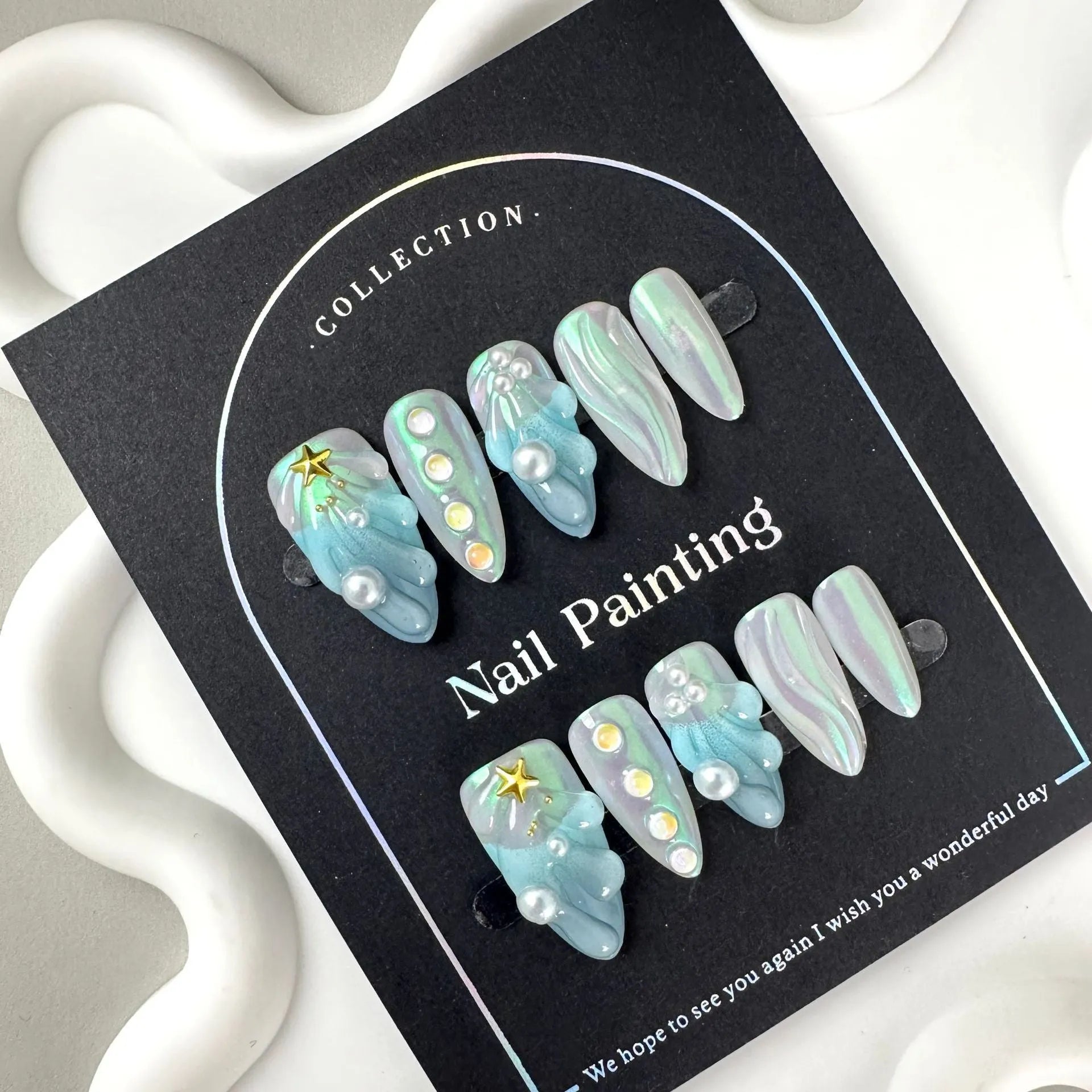 Hailang blue shell design artificial nail tips showing texture and four size options