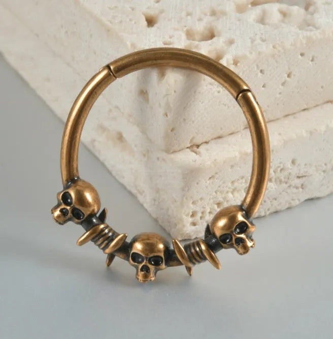 Vintage copper punk earrings with ghost head motifs in antique silver or gold finish