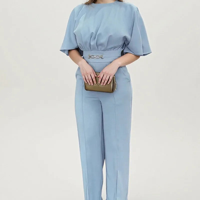 Blue men's two-piece suit with long sleeve jacket and trousers on a hanger
