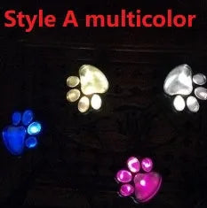 Black solar powered bear paw print garden lights set with four lights and solar panel