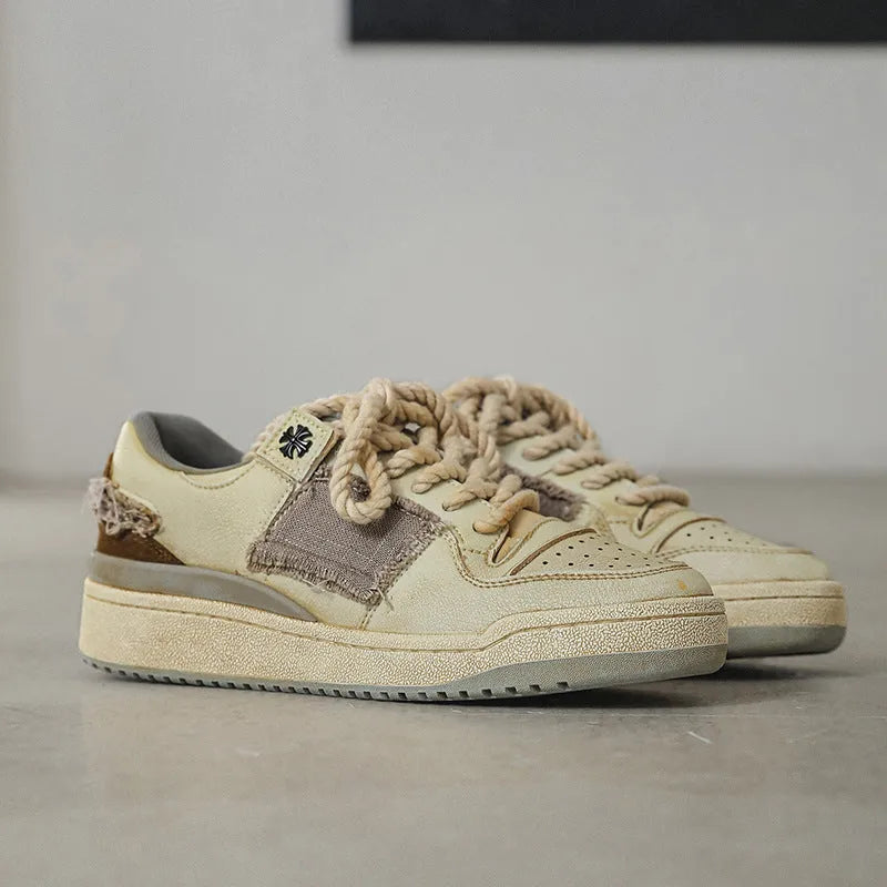Beige vintage style low-top skateboard shoes with round toe and lace-up front
