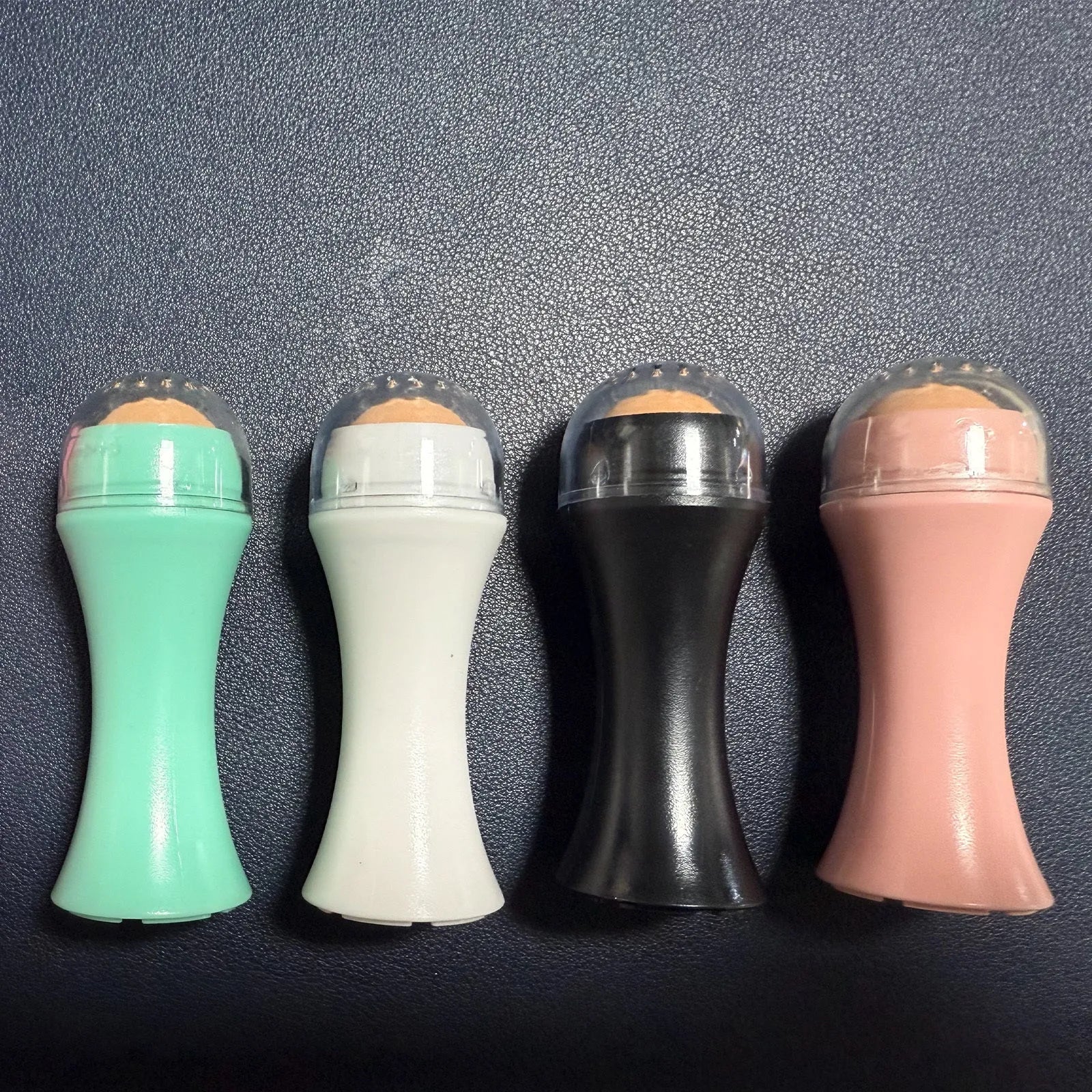 Portable volcanic stone facial roller for oily skin control in choice of colours