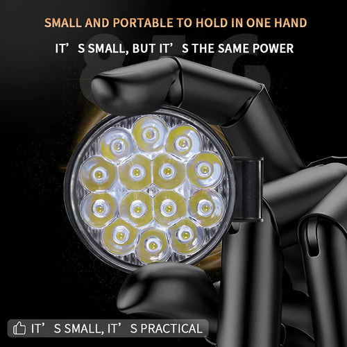 Mini round 42W LED work light with aluminium housing, emitting white light for vehicle use.