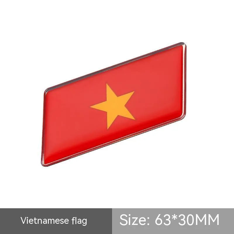 Aluminium parallelogram car sticker with national flag design measuring 6.3 by 3 cm