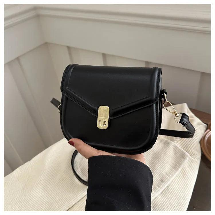 Soft PU shoulder messenger bag in horizontal square clamshell shape with niche texture.