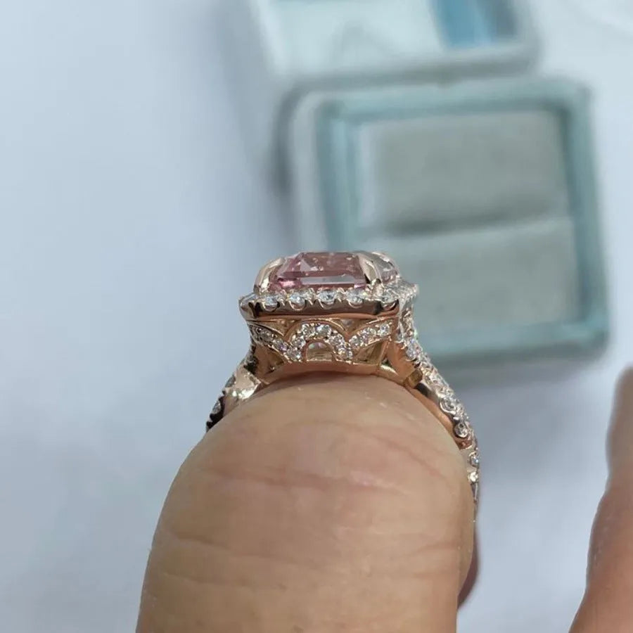 Rose gold electroplated alloy ring with geometrical design shown on hand