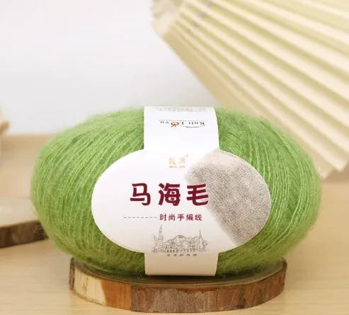 Single ball of mohair yarn in various colours for hand-woven DIY scarf knitting projects