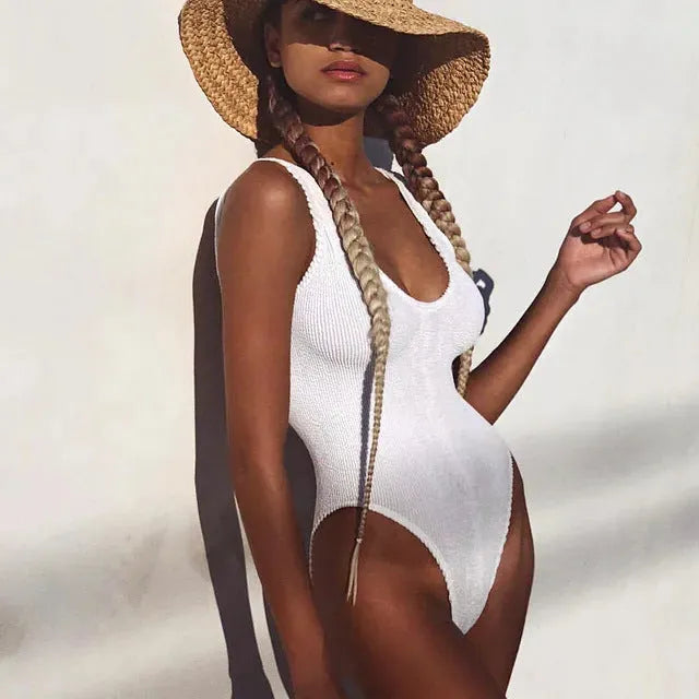 Backless one-piece swimsuit in textured seersucker bubble cloth fabric on a model.