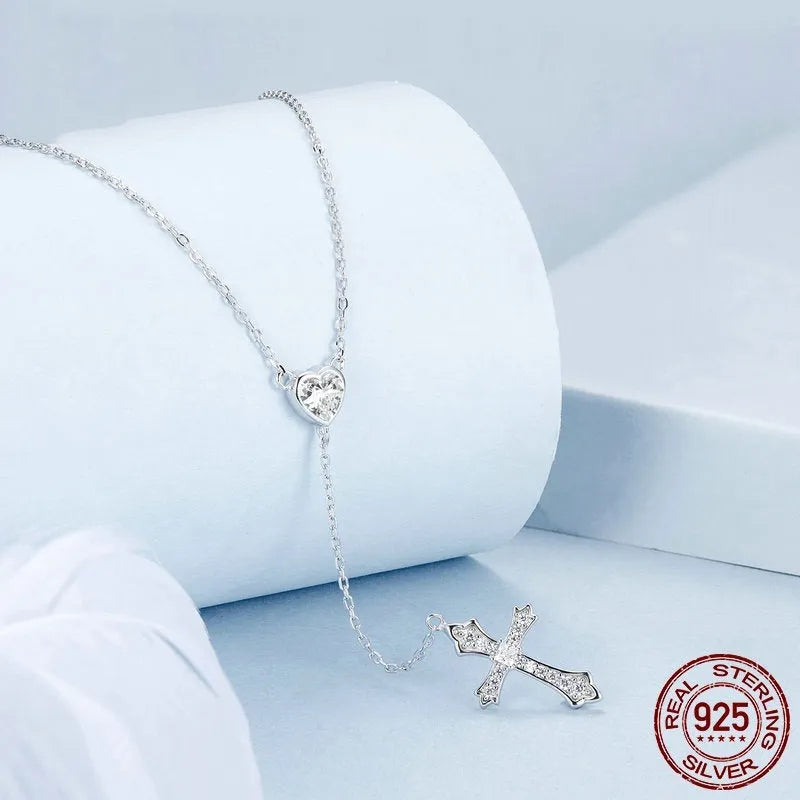Women's silver love cross necklace on a V-neck O-ring chain, BSN384 colour.