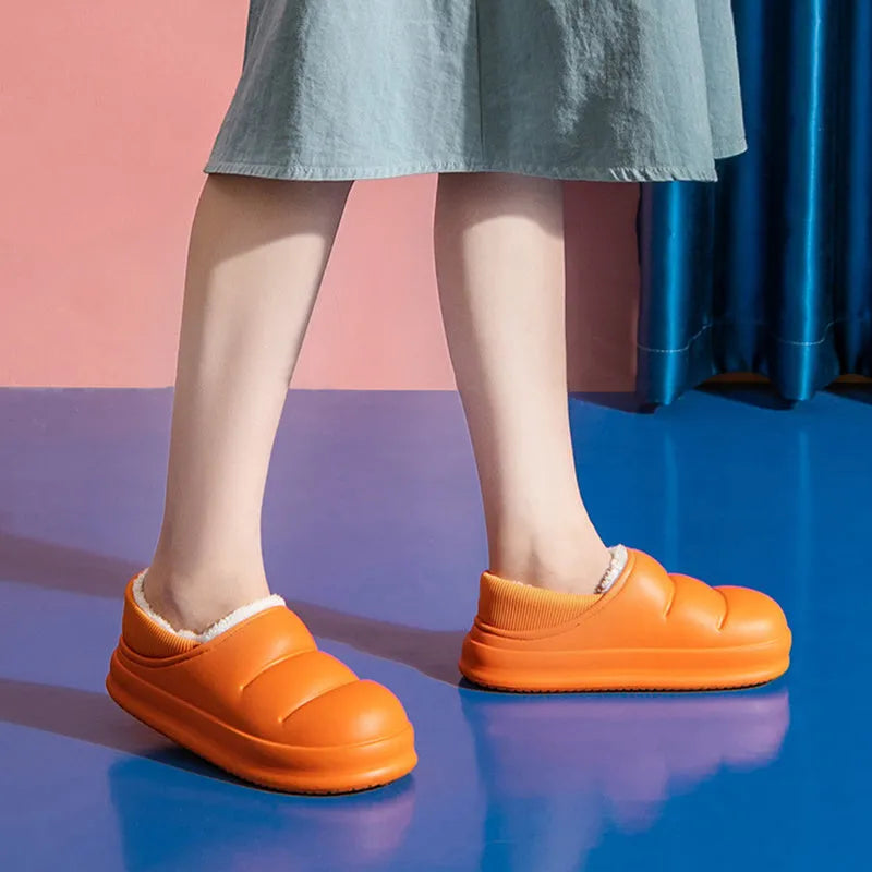 Women's waterproof garden slipper in green with plush lining and a textured non-slip EVA sole.