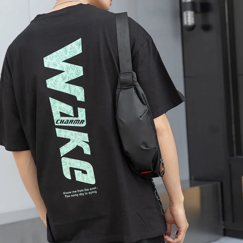 Black oxford cloth men's waist pack showing zipper opening and internal organisation pockets.