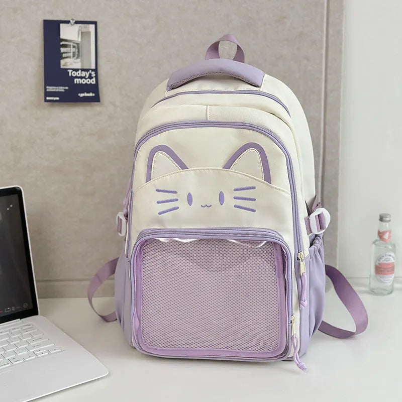 Korean cartoon large capacity nylon backpack in pink colour with badge pendant.