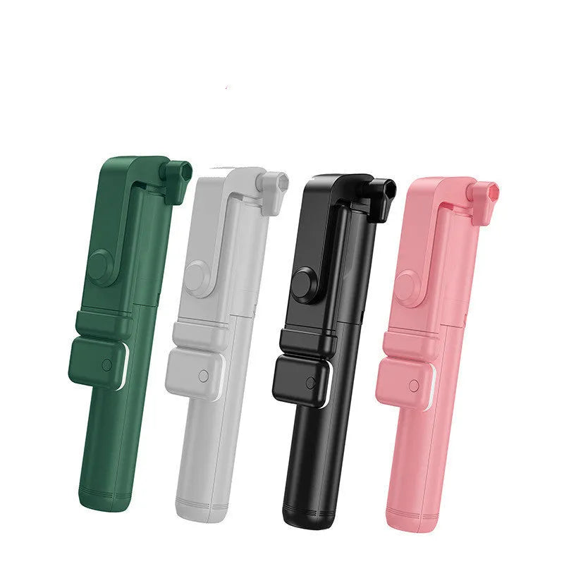 Black aluminium alloy Bluetooth selfie stick with extended tripod legs and a phone attached to the 360-degree rotating holder.