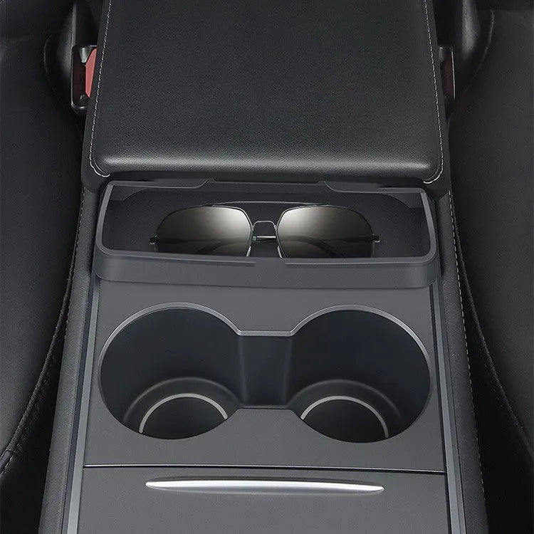 Black silicone sunglasses holder mounted on Tesla Model 3 centre console armrest