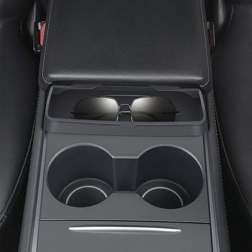 Black silicone sunglasses holder mounted on Tesla Model 3 centre console armrest