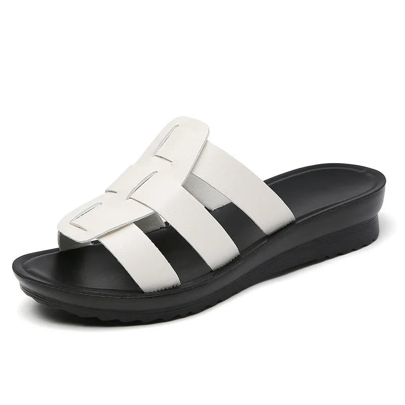 Beige women's flat-bottom slippers with a PU leather toe and soft sole.