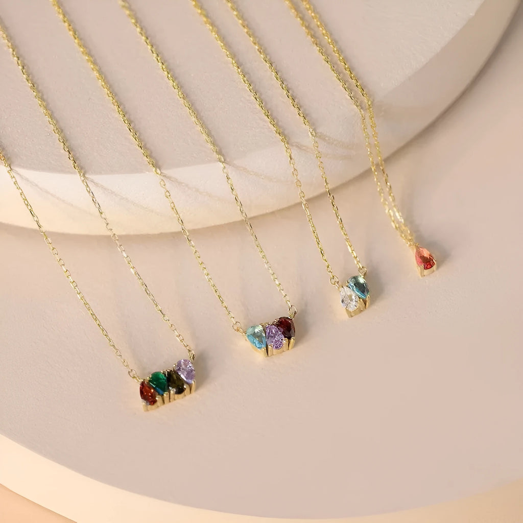 Titanium steel birthstone necklace with zircon stones in silver, gold, or rose gold on a model.