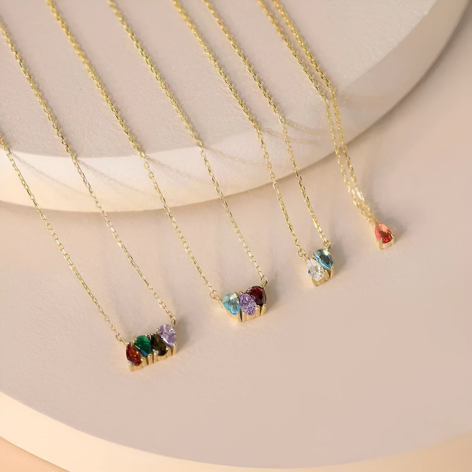 Titanium steel birthstone necklace with zircon stones in silver, gold, or rose gold on a model.
