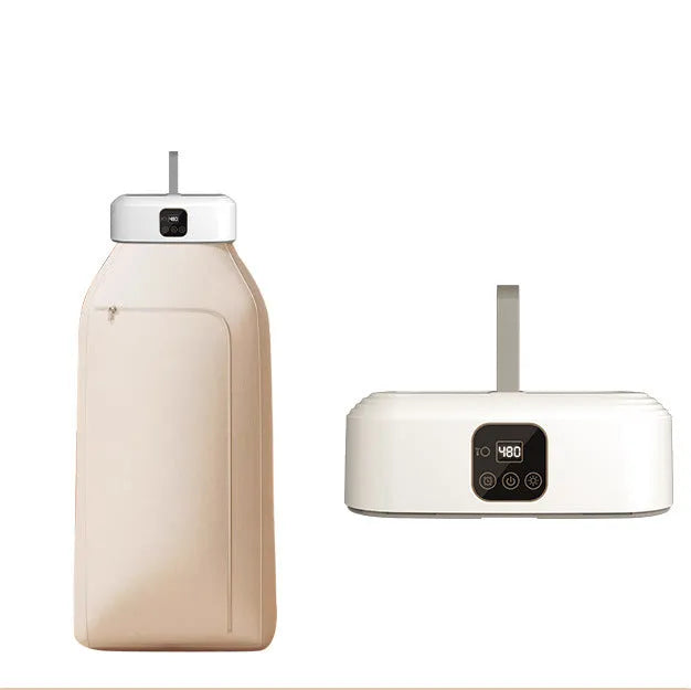 White foldable portable clothes dryer with remote control on countertop