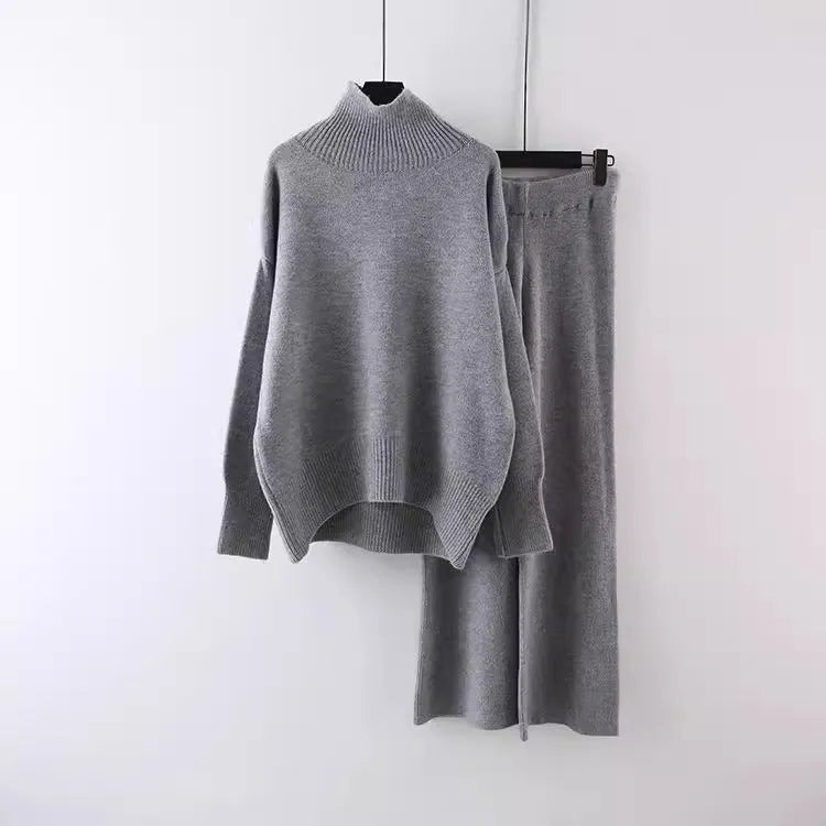 Women's solid colour sweater and wide leg trousers two-piece set in beige, shown as a coordinated outfit.