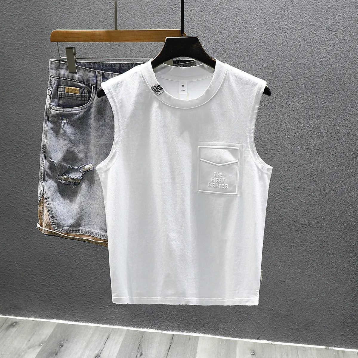 Men's loose fit cotton sleeveless t-shirt in black or white with straight hem design