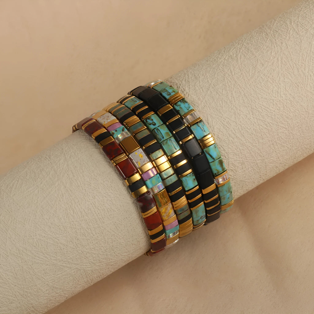 Geometric beaded pull-on bracelet in milky white, black, green, blue, or red colours
