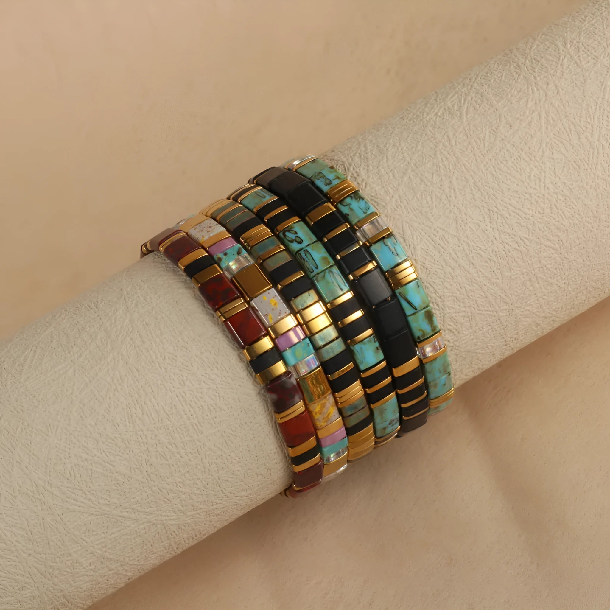 Geometric beaded pull-on bracelet in milky white, black, green, blue, or red colours