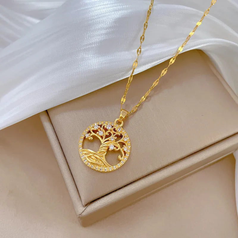 Gold plated Lucky Tree Light necklace with rhinestone details and a Mother Pearl pendant on an adjustable chain.