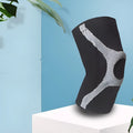 Red and grey silicone non-slip sports knee pads for running and climbing protection.