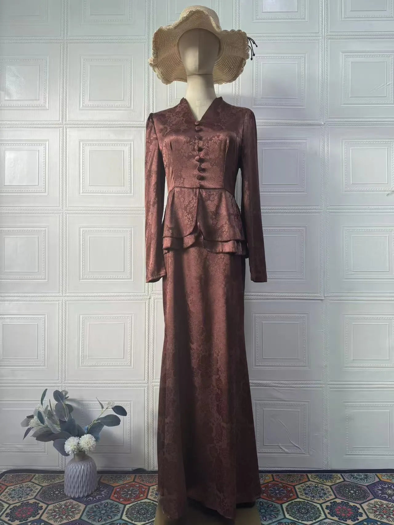 Dark brown artistic retro long sleeve pullover dress with plant pattern and button detail.