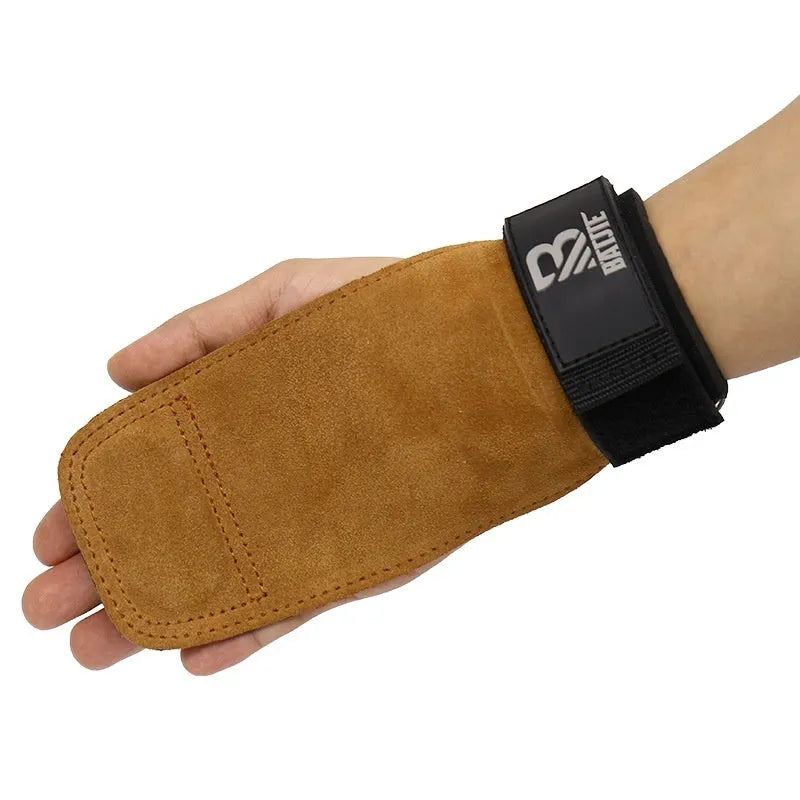 A pair of brown fitness wrist protectors for gym equipment and pull-up bar exercises.