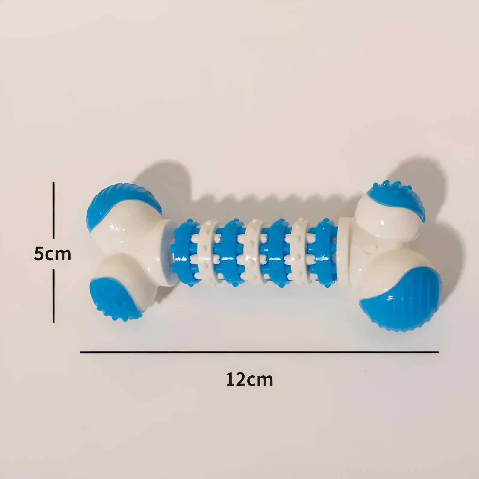 Small blue bone-shaped dog toy with textured chewable ends and central treat compartment